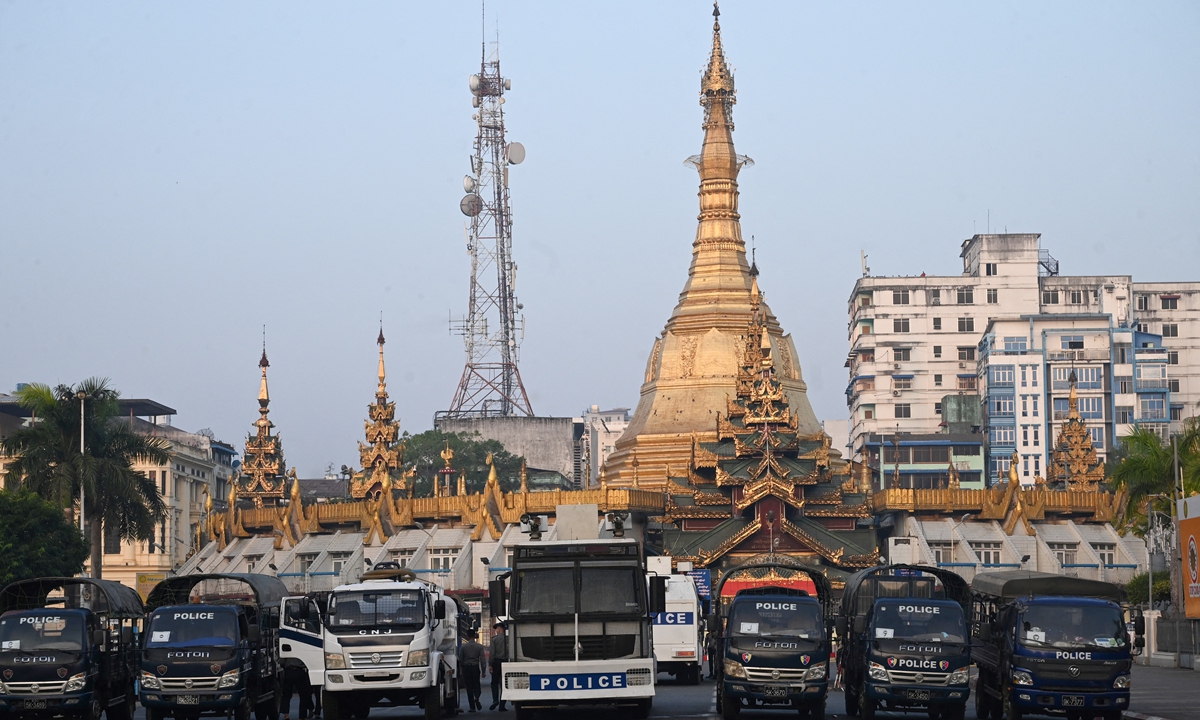 Police vehicles barricade a road outside Sule Pagoda, next to Yangon City Hall in Yangon, Myanmar on February 16. Photo: AFP