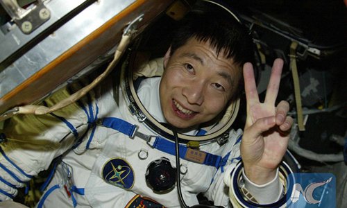 Photo taken on Oct. 16, 2003 shows astronaut Yang Liwei getting out of the re-entry capsule of China's Shenzhou-5 spacecraft following its successful landing in north China's Inner Mongolia Autonomous Region. (Xinhua/Wang Jianmin)